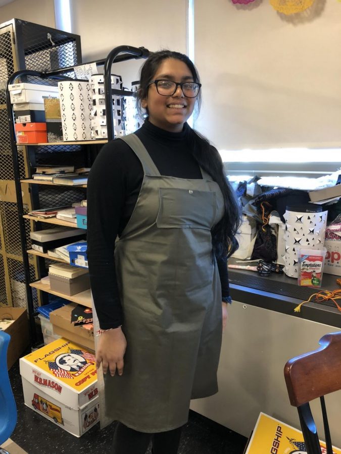 LHS+Sophomore+Jessica+Patel+showing+off+the+overalls+she+made+in+sewing+club.%0A