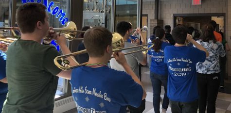 LHS Marching Band celebrates Mardis Gras with a tribute through the halls of LHS