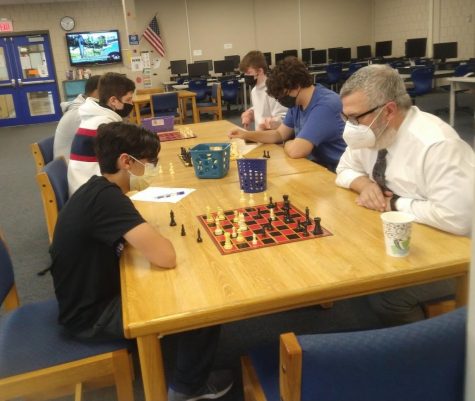Student test their planning and foresight as they play each other in Chess Club after school. 