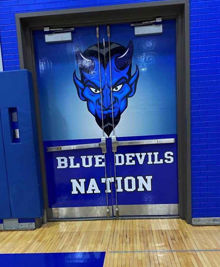 The+Blue+Devil+logo+on+the+gym+doors+was+created+by+the+students+in+CTEis+Graphic+Communications+Department