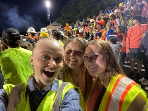 Enjoying the game from the cheering section. 
From left to right Caroline Ejby Bjornvig, Sarah Potter, and Lindsey Arseneau