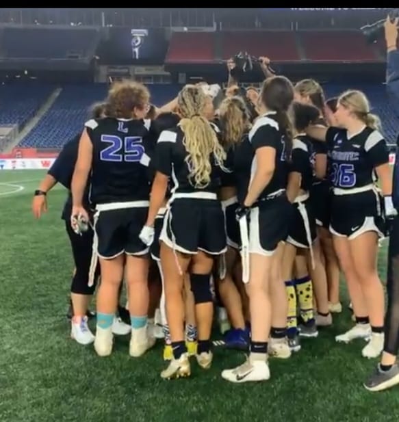 The Blue Devils Championship Flag Football Team celebrates on the field of Gillette following their victory.