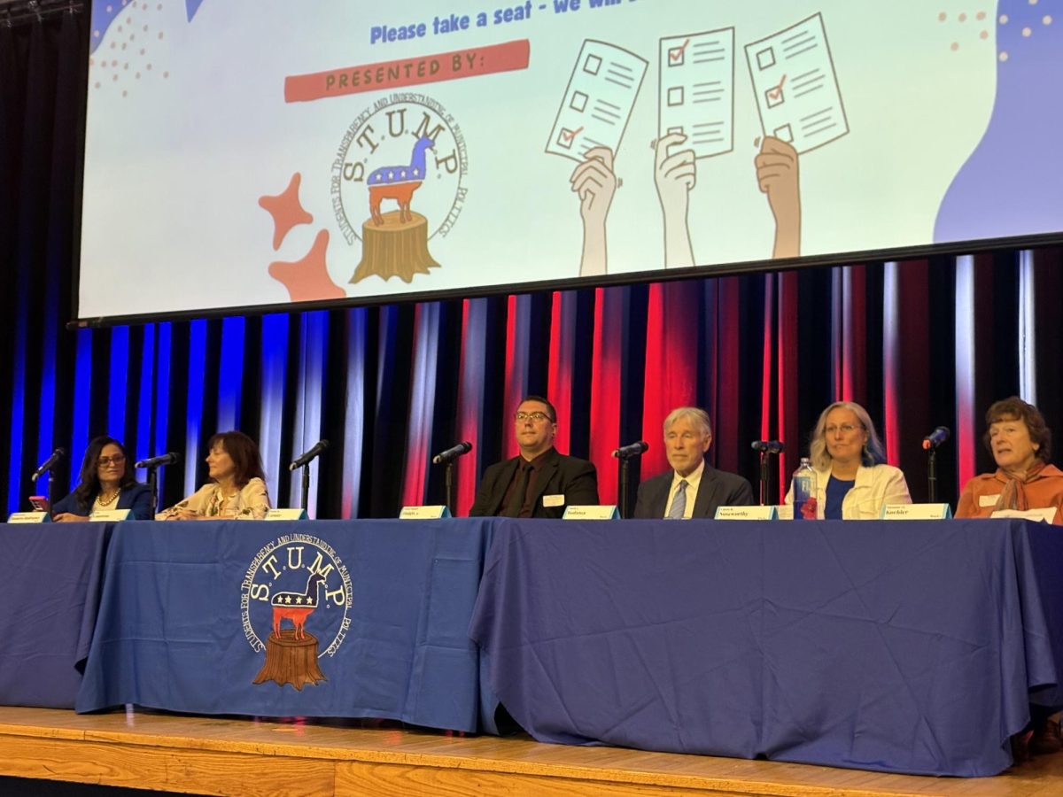 Candidates present at the forum, listed from left: Eladia Romero Rodriguez, Lisa Contreras, Peter Haigis, Mark Bodanza, Carrie Noseworthy, and Sue Kohler.
