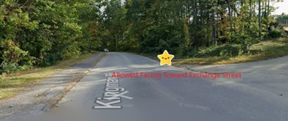 Officer Kwan demonstrates the correct location to park on Kingman Drive. On the right, facing away from the school toward Exchange Street. 