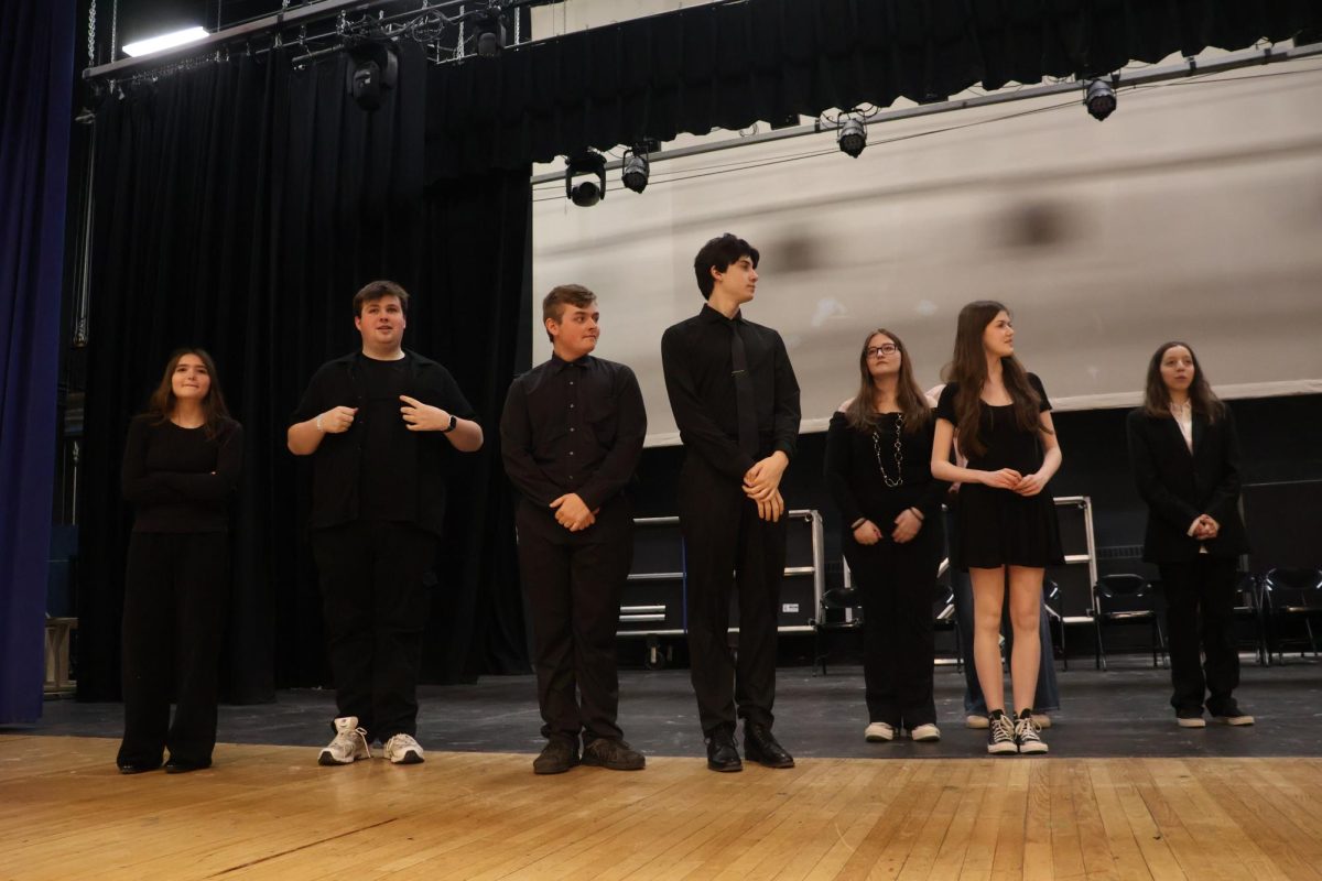 Members of the LHS Theatre Company rehearse for their new show Too Much Light Makes the Baby Go Blind. From left: LHS Sophomore Paige Prentiss, LHS Junior Andrew Sallese, LHS Junior CJ Evans, LHS Junior Nathan Daniels, LHS Junior Emma Wood, LHS Junior Liliana Richards, LHS freshman Siena Gradito.
 
